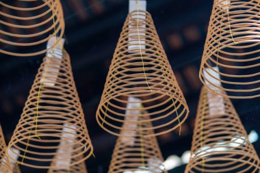 Close up of spiral incense at Thien Hau Temple in Ho Chi Minh City, Vietnam. Religion concept.