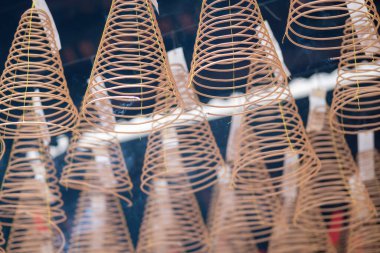 Close up of spiral incense at Thien Hau Temple in Ho Chi Minh City, Vietnam. Religion concept.