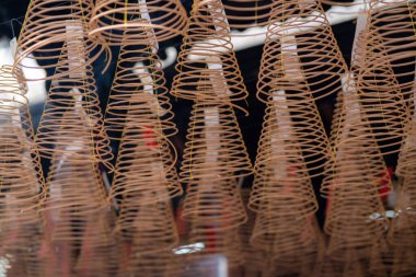 Close up of spiral incense at Thien Hau Temple in Ho Chi Minh City, Vietnam. Religion concept.