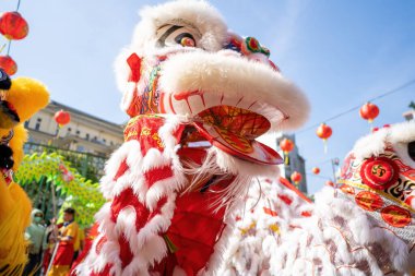 Dragon and lion dance show in chinese new year festival (Tet festival ), lion Dance - dragon and lion dance street performances in Vietnam. Holidays and celebrations concept. Selective focus.