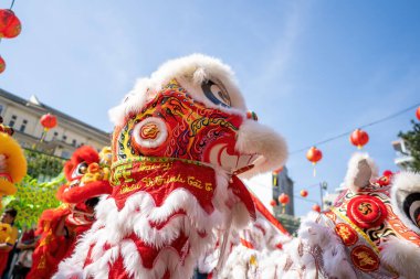 Dragon and lion dance show in chinese new year festival (Tet festival ), lion Dance - dragon and lion dance street performances in Vietnam. Holidays and celebrations concept. Selective focus.