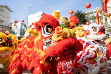 Dragon and lion dance show in chinese new year festival (Tet festival ), lion Dance - dragon and lion dance street performances in Vietnam. Holidays and celebrations concept. Selective focus.