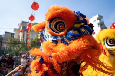Dragon and lion dance show in chinese new year festival (Tet festival ), lion Dance - dragon and lion dance street performances in Vietnam. Holidays and celebrations concept. Selective focus.