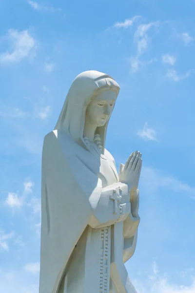 stock image view of Our lady of Lourdes Virgin Mary catholic religious statue on a Nui Cui mountain in Dong Nai province, Vietnam. Travel and religion concept.