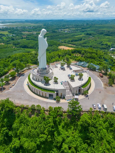 stock image Aerial view of Our lady of Lourdes Virgin Mary catholic religious statue on a Nui Cui mountain in Dong Nai province, Vietnam. Travel and religion concept.