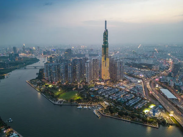 stock image Aerial view of a Ho Chi Minh City, Vietnam with development buildings, transportation, energy power infrastructure. Financial and business centers. Sunset to night. Travel and landscape concept.