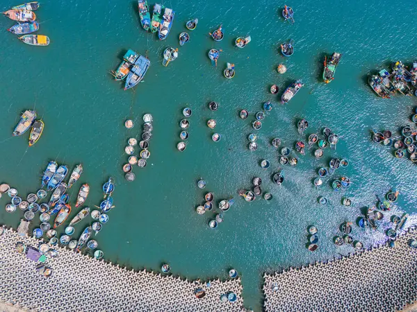 stock image Aerial view of Loc An fishing village, Vung Tau city. A fishing port with tsunami protection concrete blocks. Cityscape and traditional boats in the sea. Travel and landscape concept