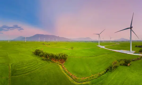 stock image view of turbine green energy electricity, windmill for electric power production, Wind turbines generating electricity on rice field at Phan Rang, Ninh Thuan province, Vietnam. Clean energy concept.