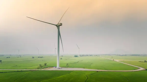 stock image view of turbine green energy electricity, windmill for electric power production, Wind turbines generating electricity on rice field at Phan Rang, Ninh Thuan province, Vietnam. Clean energy concept.