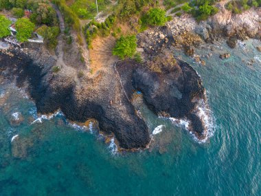 View of Ganh Da Dia or Da Dia Reef is a seashore area of uniformly interlocking basalt rock columns located along the coast in Tuy An town, Phu Yen Province, Vietnam. Travel and landscape concept clipart