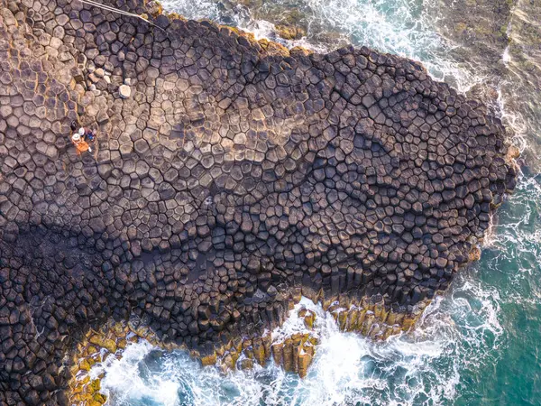 stock image View of Ganh Da Dia or Da Dia Reef is a seashore area of uniformly interlocking basalt rock columns located along the coast in Tuy An town, Phu Yen Province, Vietnam. Travel and landscape concept