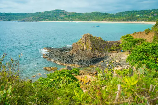 stock image View of Ganh Da Dia or Da Dia Reef is a seashore area of uniformly interlocking basalt rock columns located along the coast in Tuy An town, Phu Yen Province, Vietnam. Travel and landscape concept