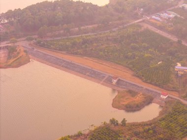 Aerial view of Bien Ho Che or Bien Ho tea fields, outside Pleiku city, Gia Lai province, Vietnam. Nature landscape, mountain and foggy far away. Travel and landscape concept. clipart