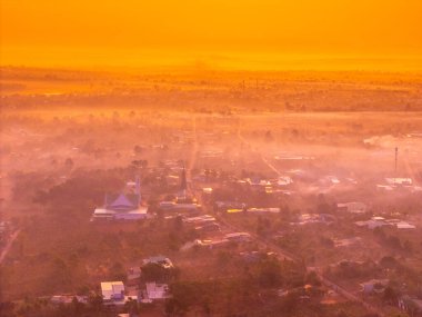 Aerial view of Bien Ho Che or Bien Ho tea fields, outside Pleiku city, Gia Lai province, Vietnam. Nature landscape, mountain and foggy far away. Travel and landscape concept. clipart