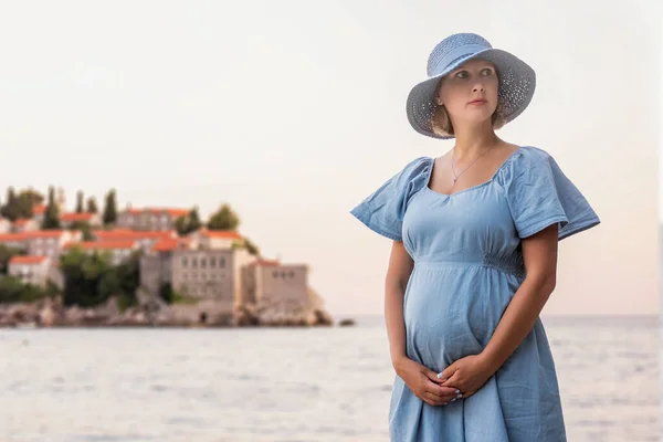 Pregnant Woman Traveler Hugs Baby Her Belly Island Sveti Stefan — Stockfoto