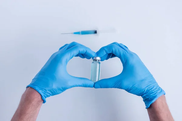 White Isolated Background Doctors Hands Medical Blue Gloves Depict Heart — Stockfoto