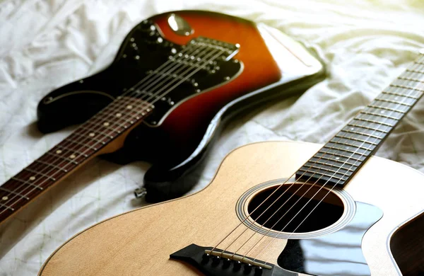 acoustic guitar and electric guitar, Used to play music and notes, for sing a song, macro abstract