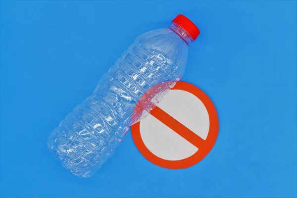 Single-use plastic water bottle. Do not consume non-biodegradable plastic. Copy space. Top wiew