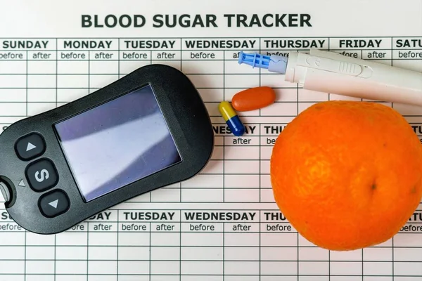 Medical equipment to measure blood glucose level with a lancing device with a pen. Testing blood sugar levels in diabetic patients. Oranges, food to reduce high blood sugar levels.