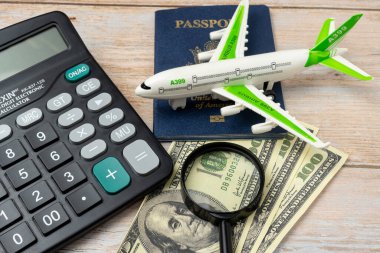 Passport usa, plane and magnifying glass. Top wiew. Copy space. Concept of leisure and business travel. concept cheap travel search engine. clipart
