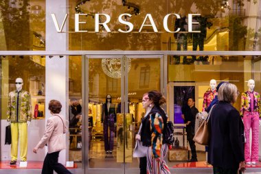 Barcelona, Spain-April 29, 2023. Versace, Italian fashion house, based in Milan, Lombardy. Founded by Gianni Versace in 1978 and owned by Michael Kors. Logo on the front door clipart