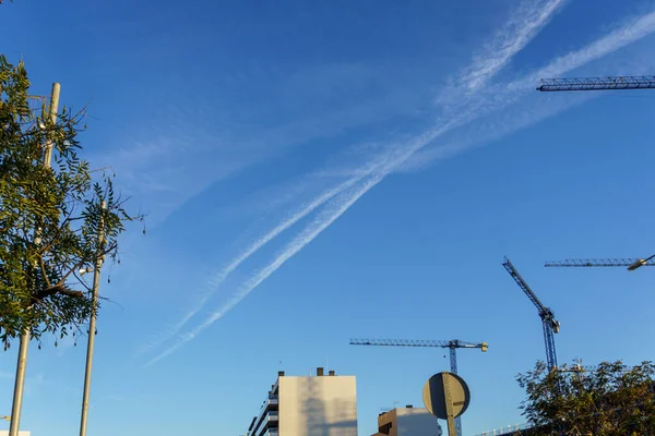 Blue sky with chemtrails. Conspiracy theory of chemtrails.
