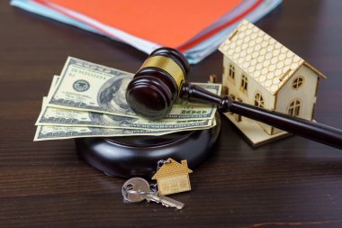 House keys and judge gavel. Concept purchase sale, rent, auction, mortgage. The arrest of property, the imposition of restrictions. Real estate and law concept clipart