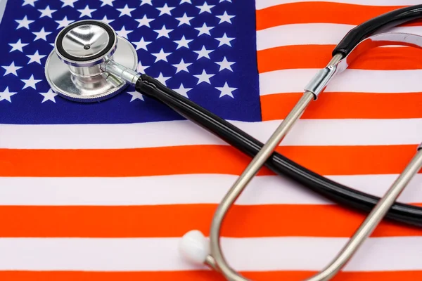 Patriotic Healthcare: A High-Quality Image of a Stethoscope on the American Flag Representing the Intersection of National Pride and Medical Excellence.