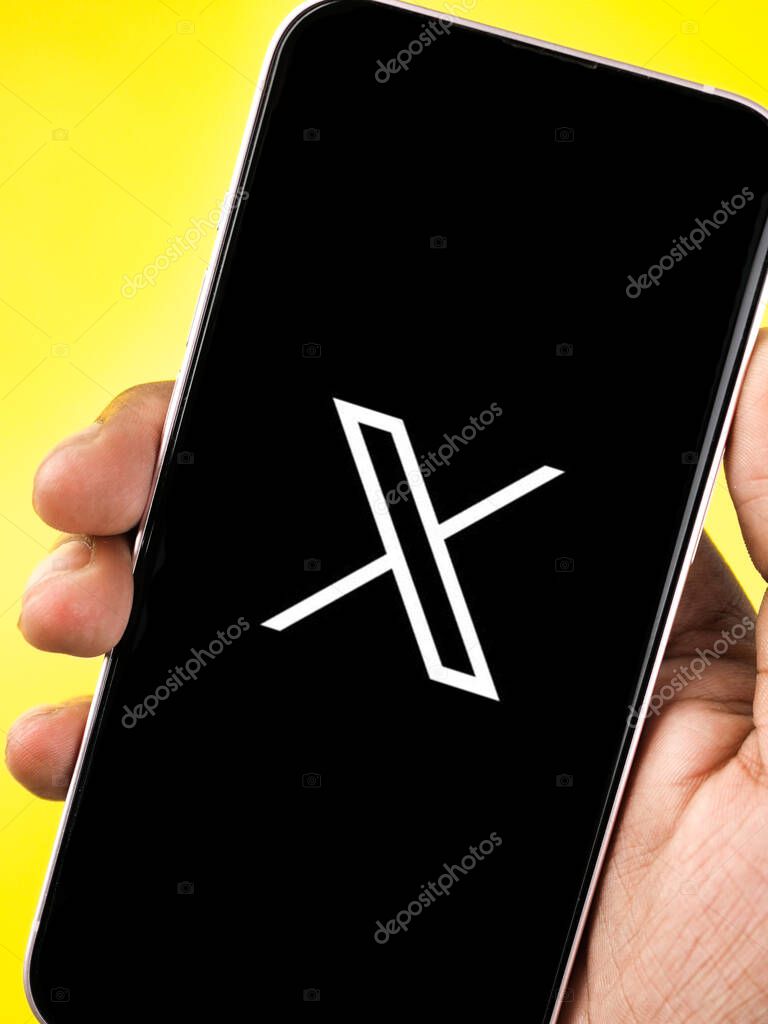 West Bangal, India - july 24, 2023 : X logo on phone screen stock image.