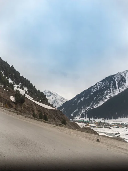 Stock image Beautiful winter landscape with snow covered trees and mountains in Kashmir.