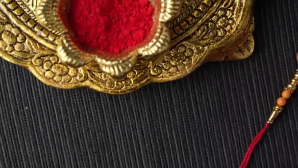 Raksha Bandhan Background Elegant Rakhi Rice Grains Wooden Textured Background — Stock Video