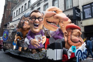 AALST, BELGIUM, 19 FEBRUARY 2023: Colorful floats with caricatures in Aalst carnival street parade. Aalst hosts one of the biggest Mardi Gras celebrations in Belgium.
