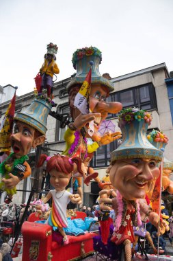 AALST, BELGIUM, 19 FEBRUARY 2023: Funny Carnival float with caricatures in the streets of Aalst.  The annual Mardi Gras parade attracts around 1000.00 spectators each year. Copy space above.