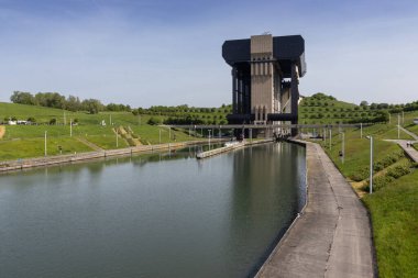 Canal du Centre at Le Roeulx, in Hainaut Province, in Wallonia, Belgium. The Strepy-Thieu boat lift ( L'ascenseur funiculaire de Strepy-Thieu) is visible in the background. Copy space below. clipart