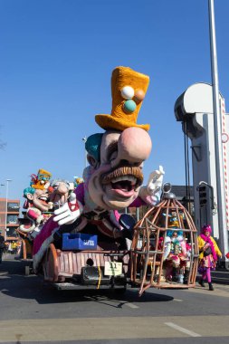 AALST, BELGIUM, 3 MARCH 2025: Carnival Group Tes Na of Noiet and float during Aalst carnival parade. Aalst Mardi Gras is the biggest carnival celebration in Flanders with 100,000 spectators