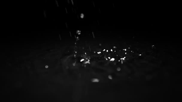 Drops Water Breaks Water Surface Black Background Slow Motion — Stock video