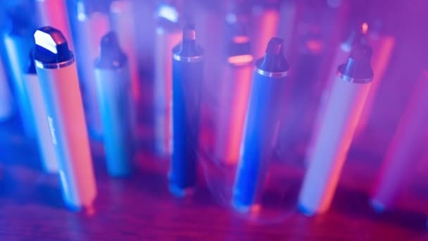 Lots Cigarettes Vapes Neon Lighting Smoke Concept Bad Habits Modern — Vídeo de Stock