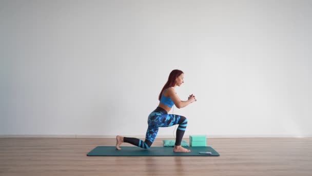 Athletic Woman Trainer Leads Online Stretching Workout White Background Online — Stock video