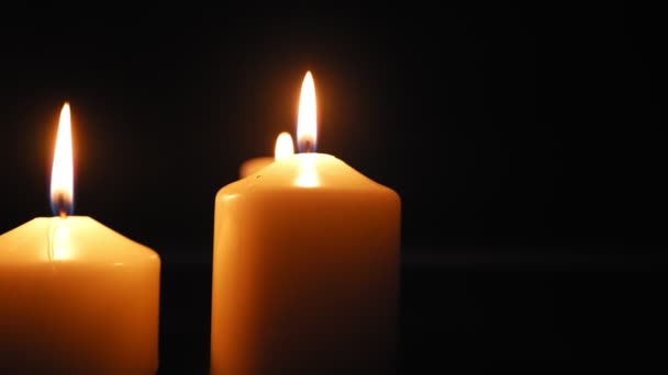 Three Candles Burn Soft Yellow Flame Dark Extinguished Wind Slow — Vídeo de Stock