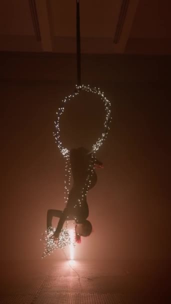 Femme Aerialist Hangs Upside Ring Decorated Glowing Christmas Garland Concept — Video