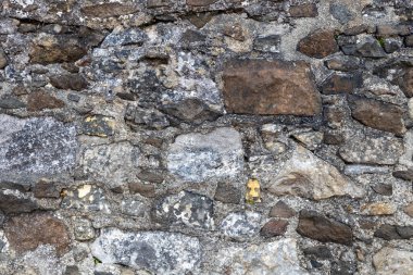 16. yüzyıl dolaylarında, engebeli bir ortaçağ taş duvarının tam çerçeve dokuma arkaplanı, fotokopi uzayı