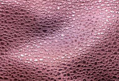 Pembe kabartmalı vinil kumaş arkaplanının tam çerçeve makro soyut doku arkaplanı