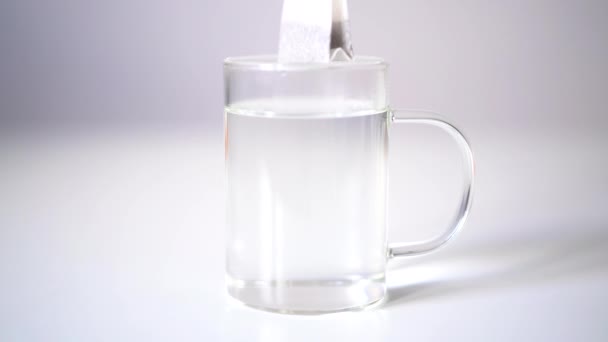 Tea Bag Black English Tea Brewed Transparent Glass Mug White — Stock Video