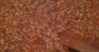 Illustration of cooking minced meat on a griddle on a large scale.