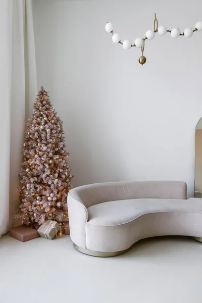 Modern light interior with couch and christmas tree