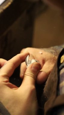 Man working on resin craft at workshop with the engraver