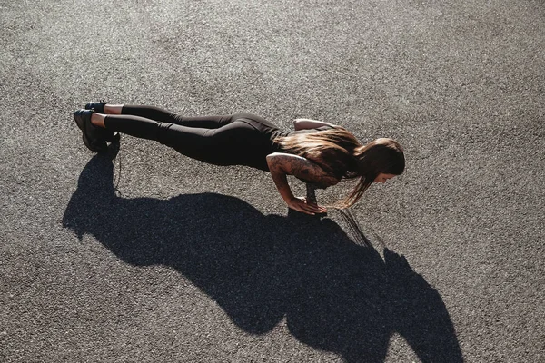 Beautiful Young Fit Tanned Caucasian Woman Doing Push Ups Outdoors Stock Picture