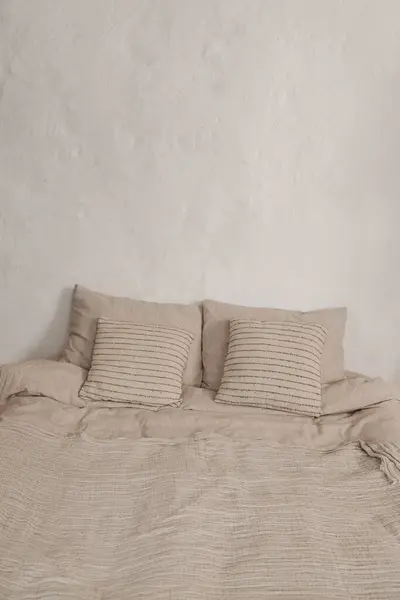White Simple Wabi Sabi Bedroom Design Comfortable Bed White Sheets Royalty Free Stock Images