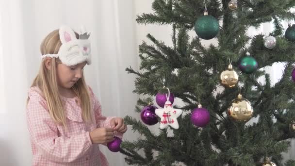 Cute Little Girl Pajamas Decorates Christmas Tree Home Balls — Stock Video