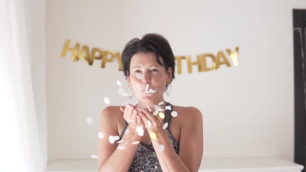 Slow Motion Shooting Happy Adult Woman Blows Shiny Candies Her — Stock Video